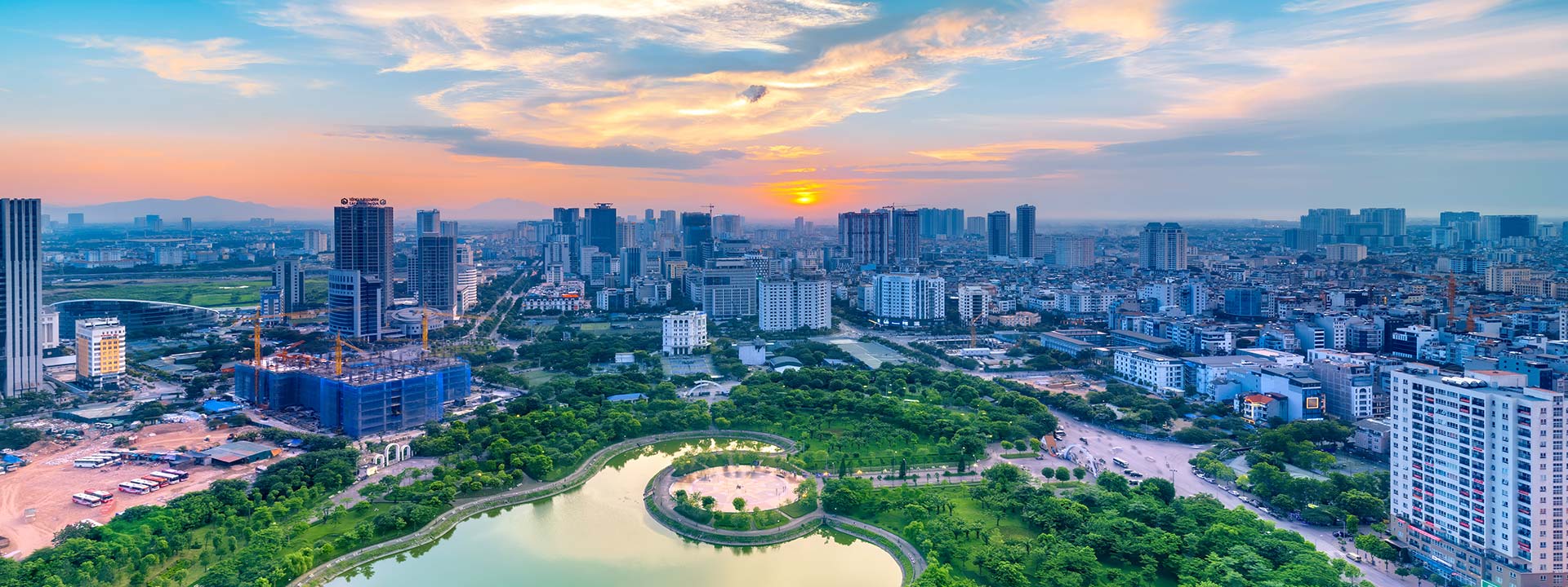 Hanoi skyline cityscape at twilight period. Cau Giay park, west of Hanoi