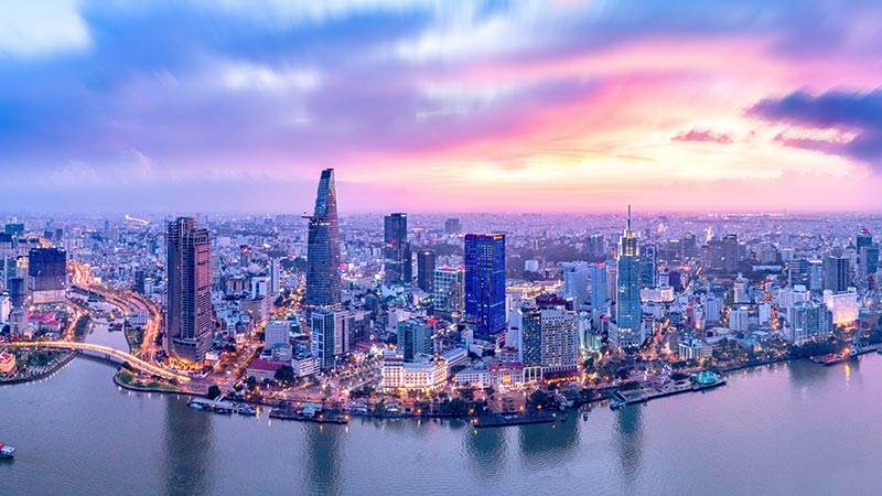 Top view aerial photo from flying drone of a Ho Chi Minh City with development buildings, transportation, energy power infrastructure. Financial and business centers in developed Vietnam.